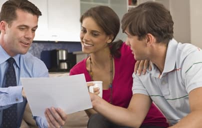 Tax professionals reviewing a personal tax return with a client